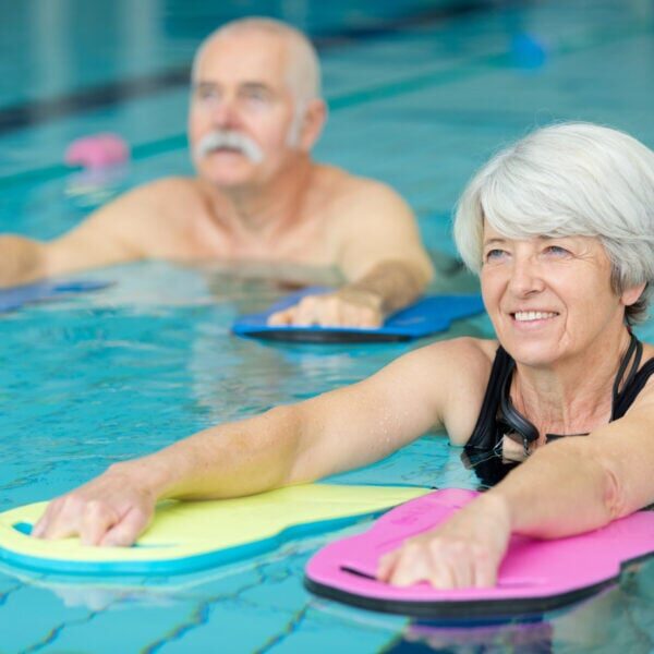 elderly doing aqua exercises in the pool